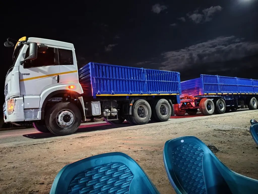 Floregine truck and blue trailers prepared for night operations