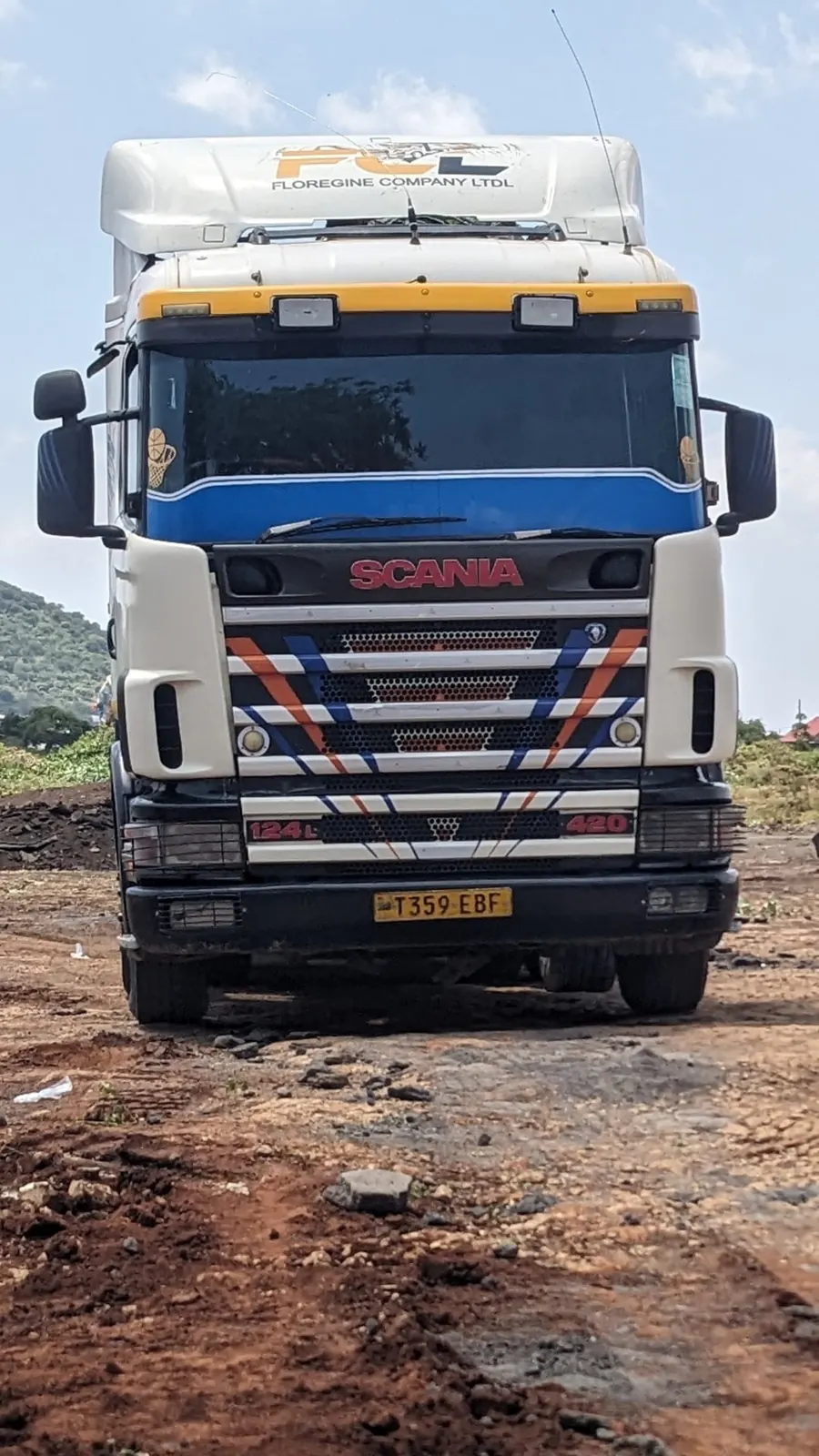 Front view of a white Floregine Scania truck